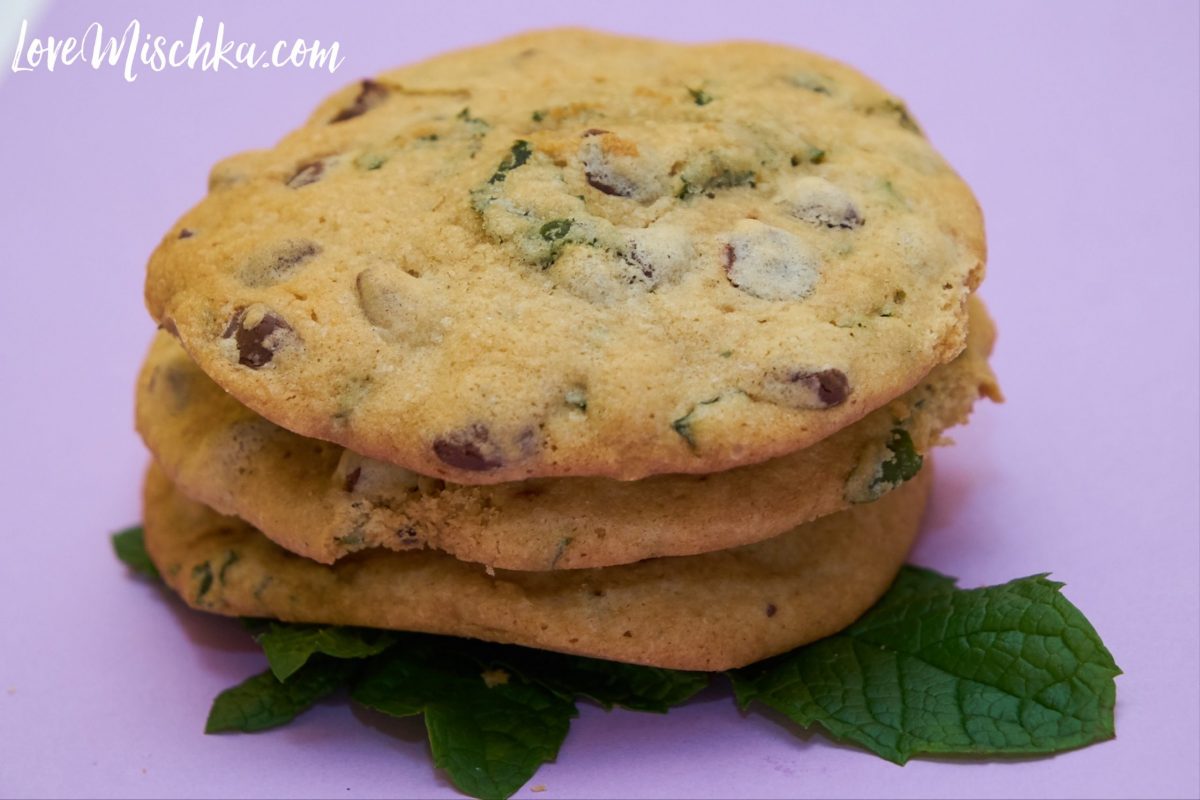 A stack of Fresh Mint Chocolate Chip Cookies on Green Mint Leaves