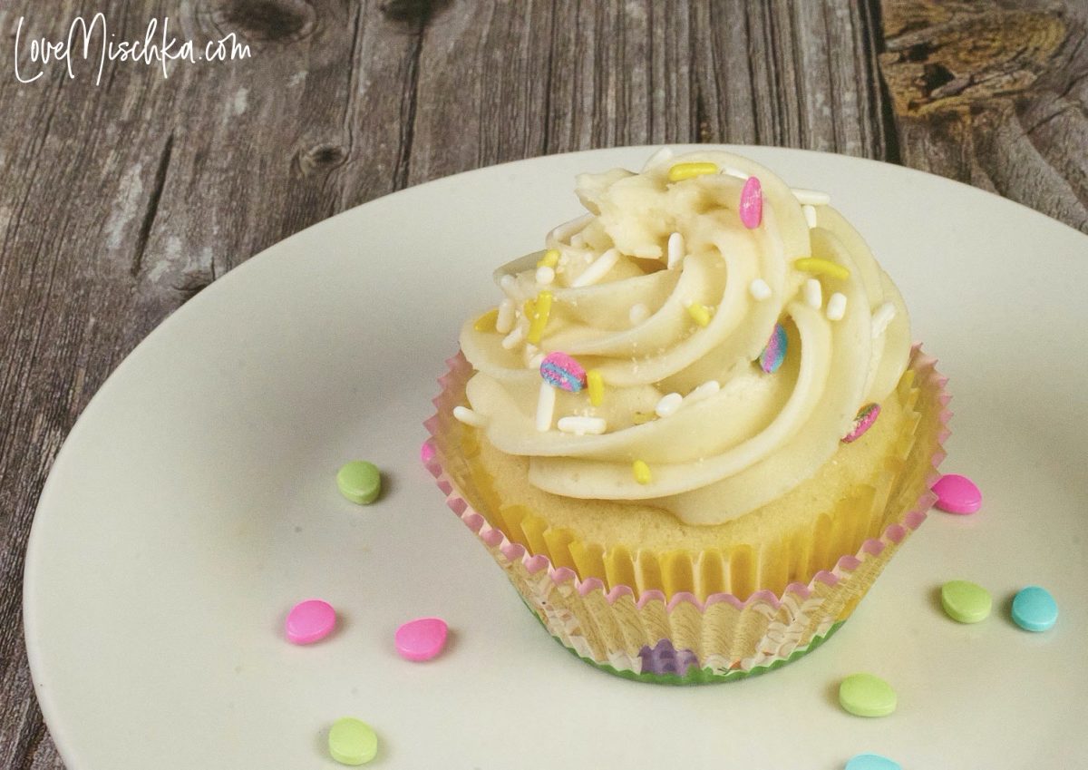 One Lemon Cupcake decorated for Easter with pastel sprinkles