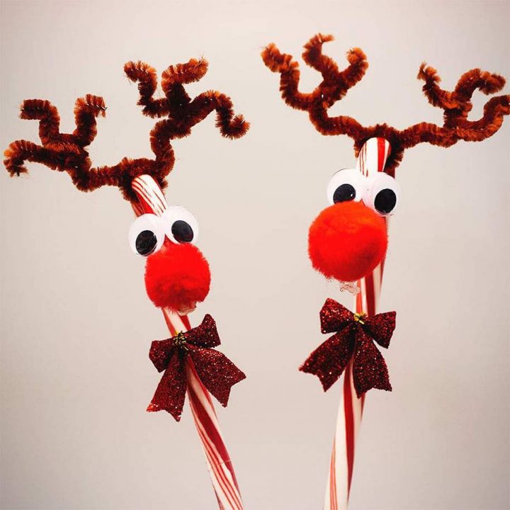 Two Reindeers made out of candy canes. Big, googley eyes, Big, red pom poms for noses, Red glitter bows around their "necks" and adorable antlers made with brown pipecleaner.