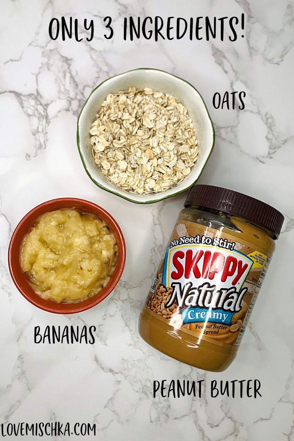 The three ingredients for peanut butter banana dog treats with oats laid out on a marble counter - Skippy Natural Peanut Butter, One Mashed Banana, and Old-Fashioned Oats. 