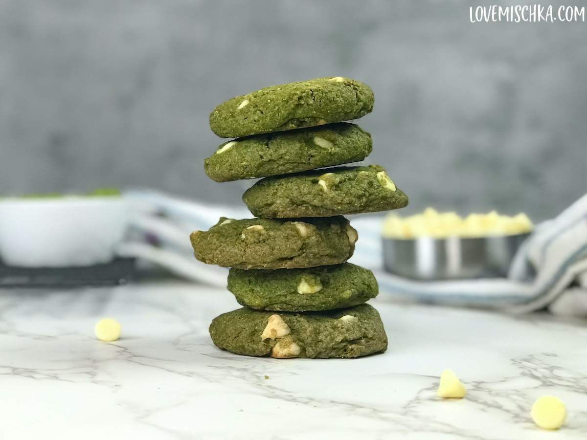 A stack of bright green matcha cookies with white chocolate chips from the best matcha cookie recipe.