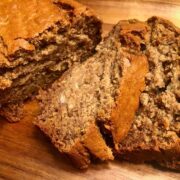 A close-up of sliced, golden brown, soft, moist banana bread (gluten free) pieces.
