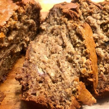 A close-up of sliced, soft, moist gluten free banana bread.