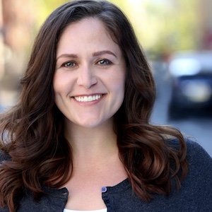 A smiling, middle age brunette - Michelle Hopkins - the owner of LoveMischkka.com.